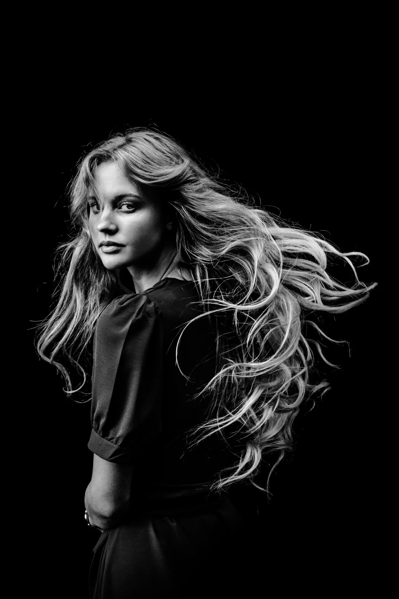 Black and white portrait of long, layered hair